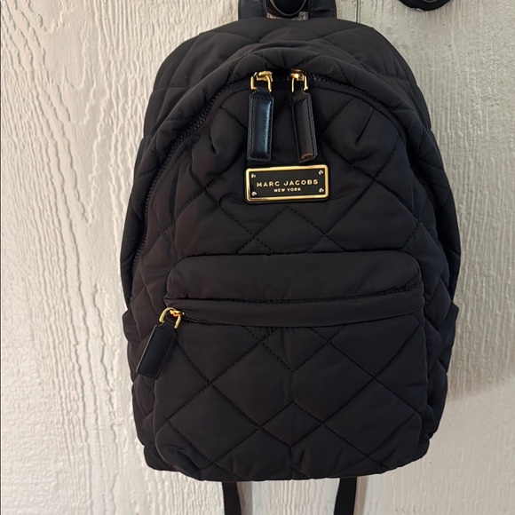 Marc Jacobs Handbags - Marc Jacobs Black Quilted Backpack with Gold Accents.